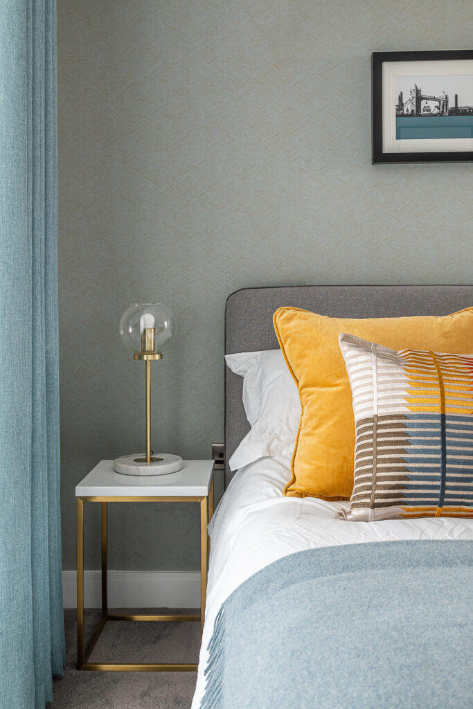 Bedroom with subtle blue wallpaper by Katie Malik Design Studio