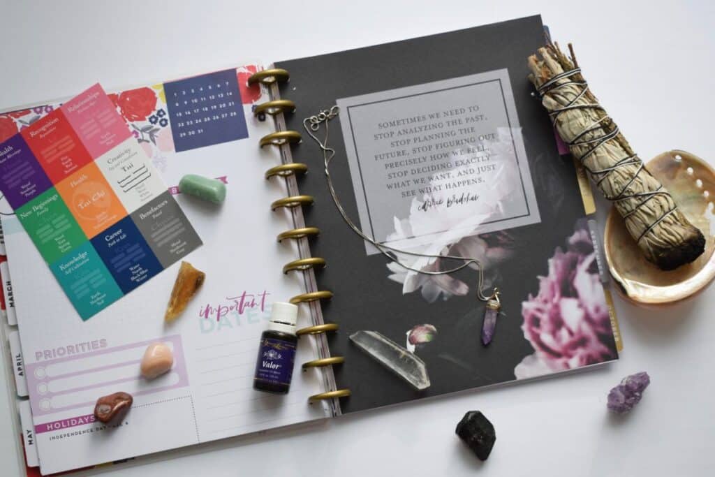 House Whispering consultation tools including dowsing rods, compass, and assessment materials used by Katie Malik for space evaluation