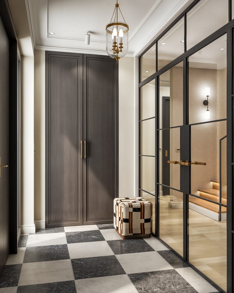 Interior design visualisation of a modern entrance hallway in a Cambridgeshire home, featuring bespoke dark wood wardrobes, a patterned ottoman, chequerboard floor tiles, and a black-framed glass partition — Katie Malik Studio.
